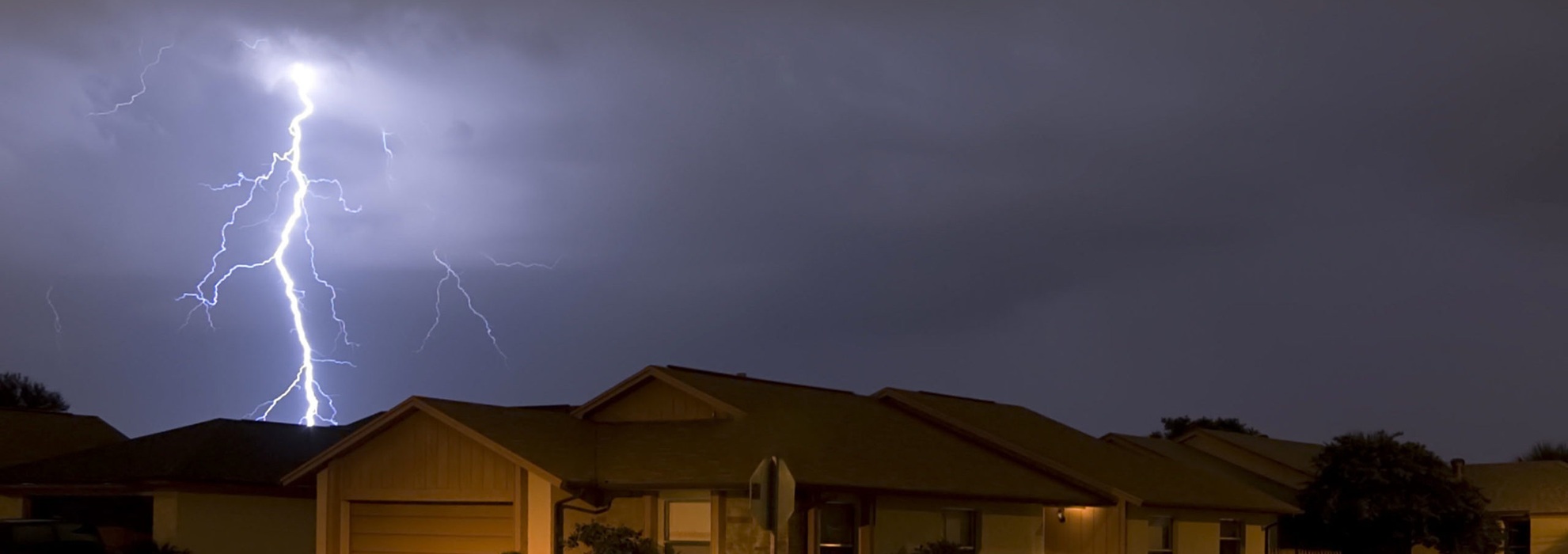 Lightning,strike,at,night,very,near,homes