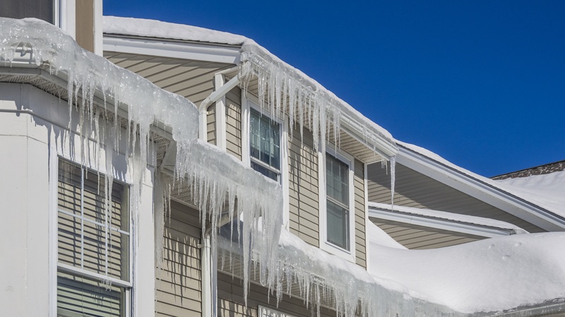 Ice Dams And Snow On Roof And Gutters