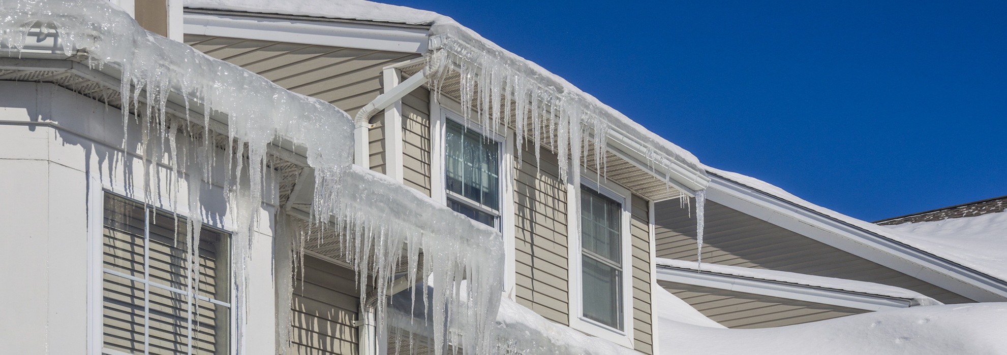 Ice Dams And Snow On Roof And Gutters