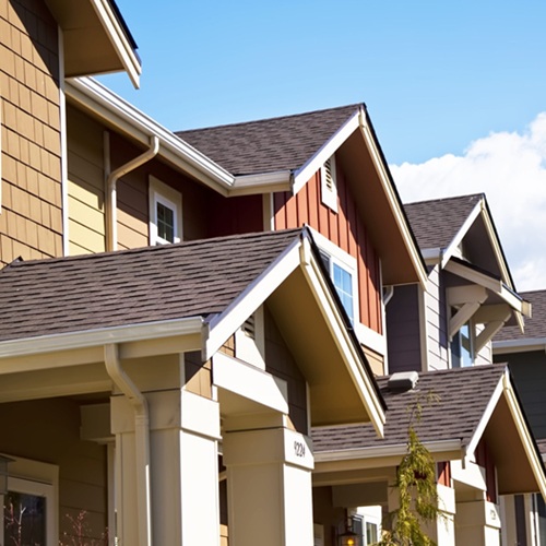 A,row,of,new,townhouses,or,condominiums.