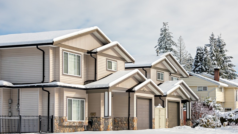 Residential Duplex House In Snow On Winter Day In Coquitlam, Bc, Canada