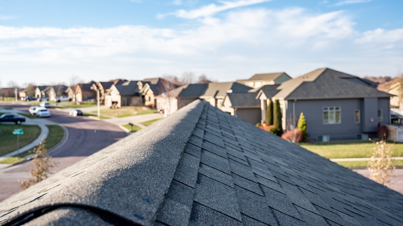View Down The Top Of An Asphalt Shingle Roof With Ridge Cap