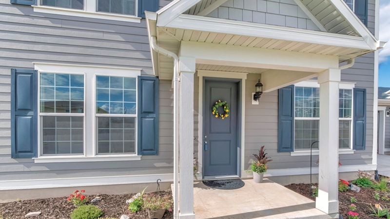 Home Exterior With Gray Wood Vinyl Siding And White Frames Home Exterior With Gray Wood Vinyl Siding And White Frames