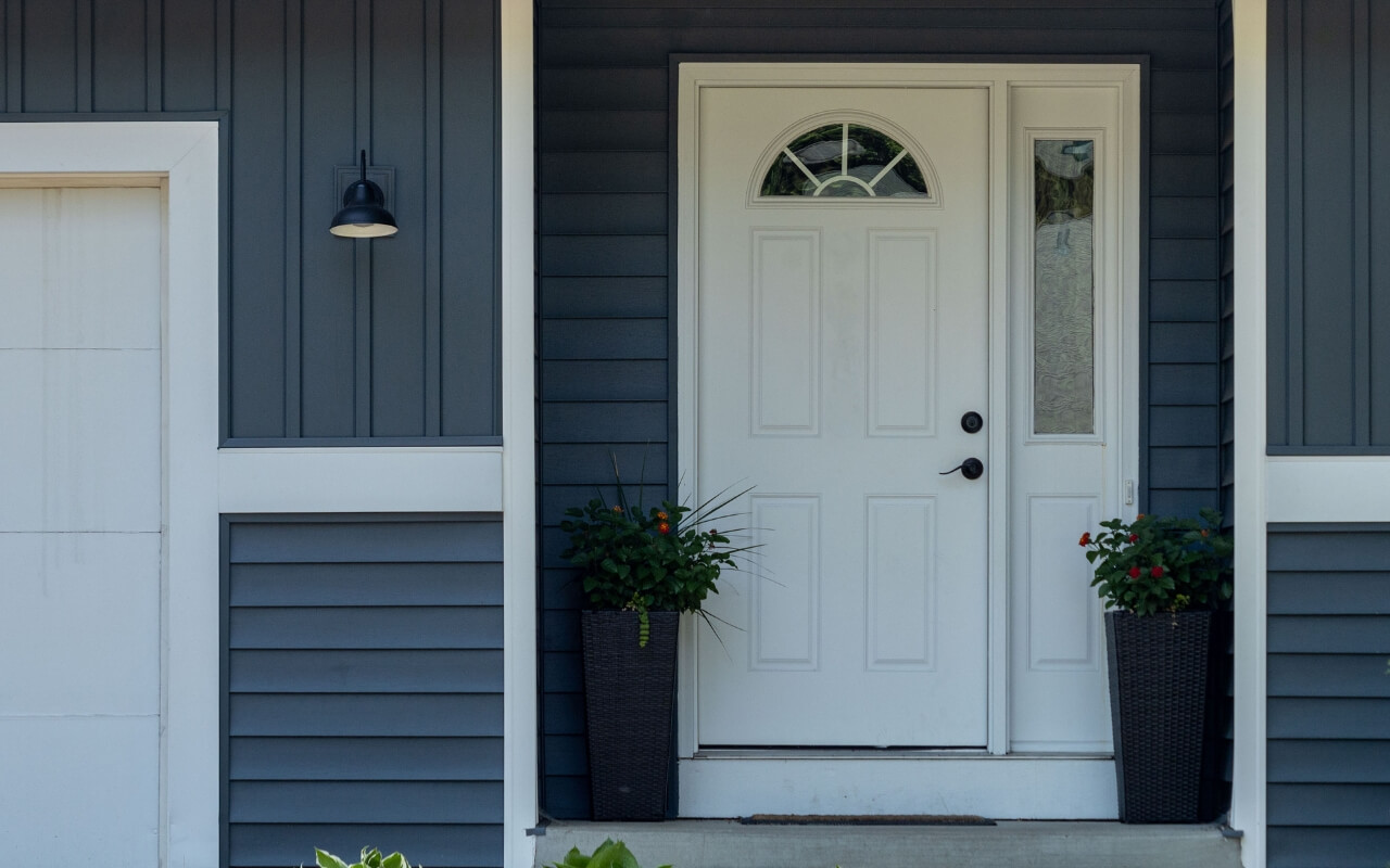 Exterior front door with decorative glass.