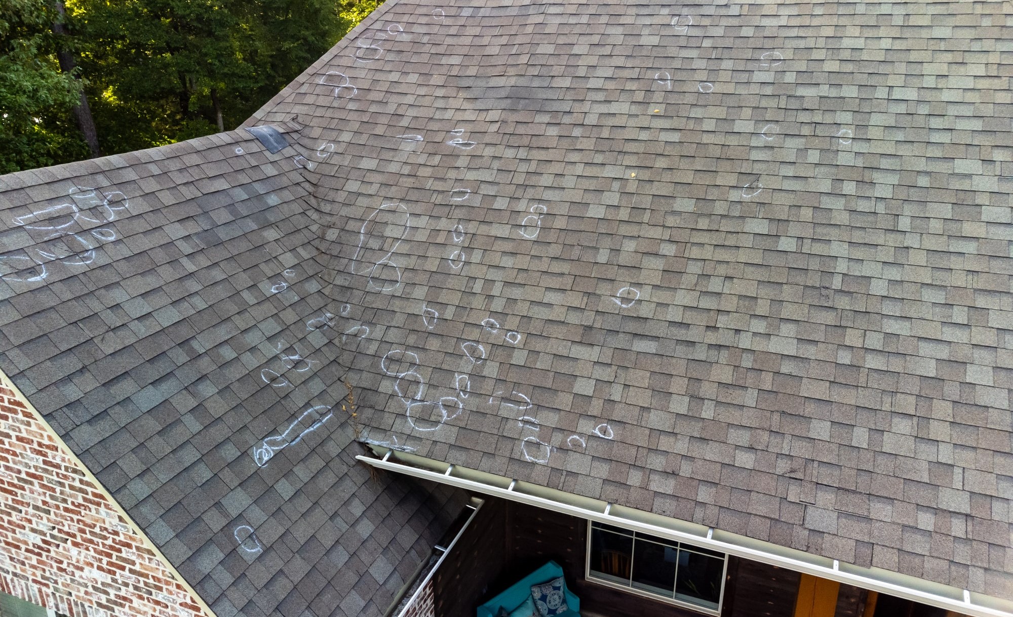 Hail damage inspection on asphalt roof