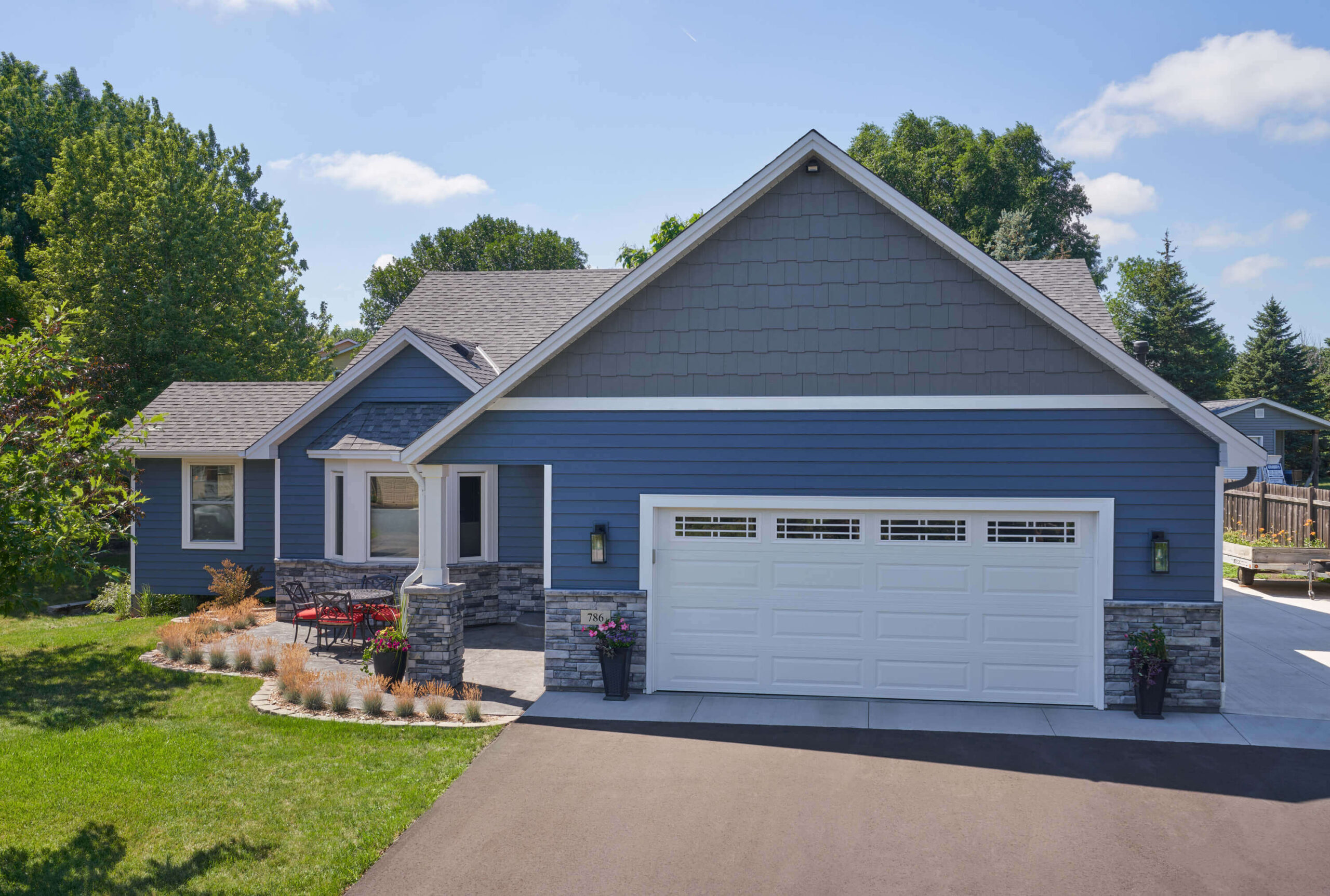 house with gray siding and blue siding