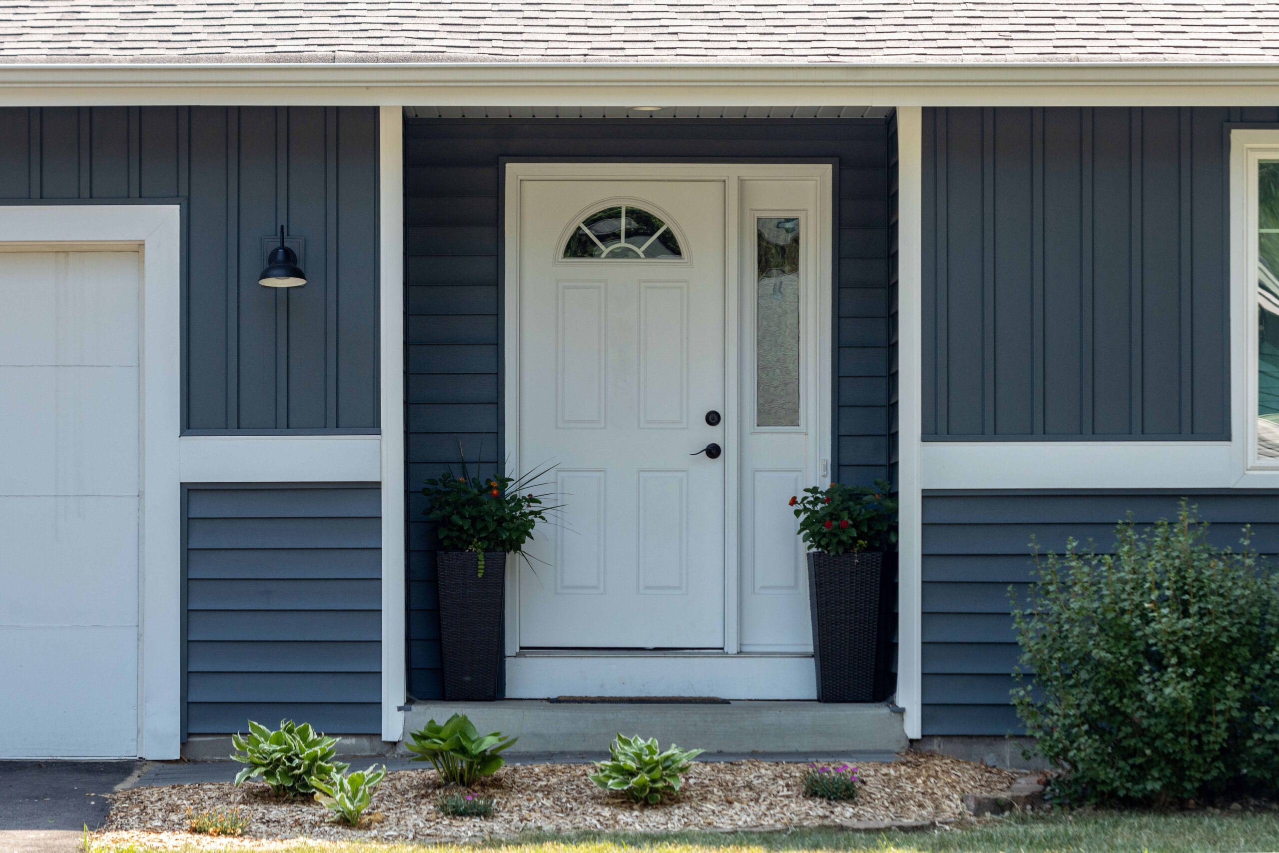 white door with a window at the top and a long window on the side